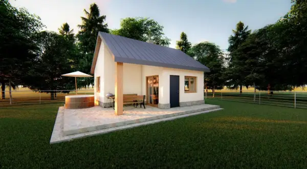 Domek murowany 35m2 koszt budowy: przytulny domek z tarasem, jacuzzi i grillem, otoczony zielenią.